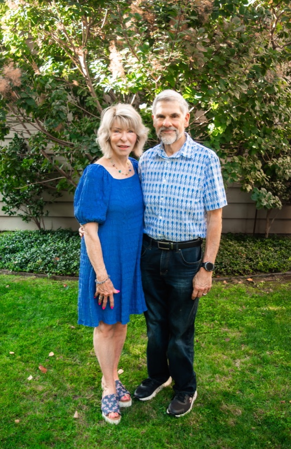 Mike and Mona Restuccia standing together in a garden